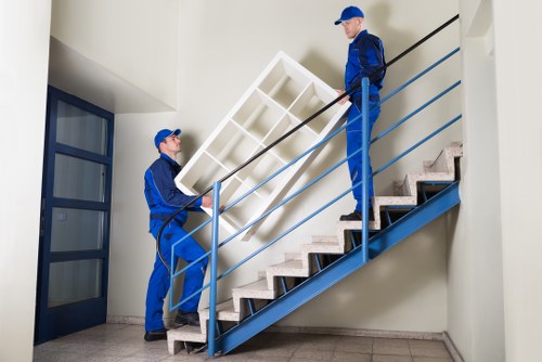 Worker estimating load-based removal pricing for a flat move in Shepherds Bush