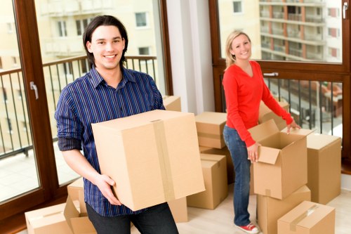 Local moving truck loaded with furniture and boxes in West London
